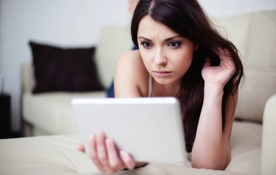 woman-sad-tablet-140409